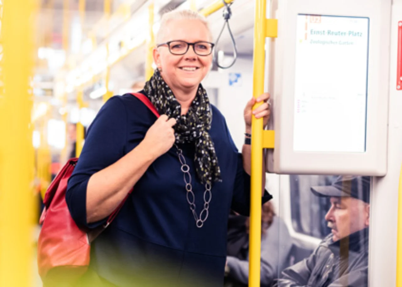 Angela with a backpack on the bus